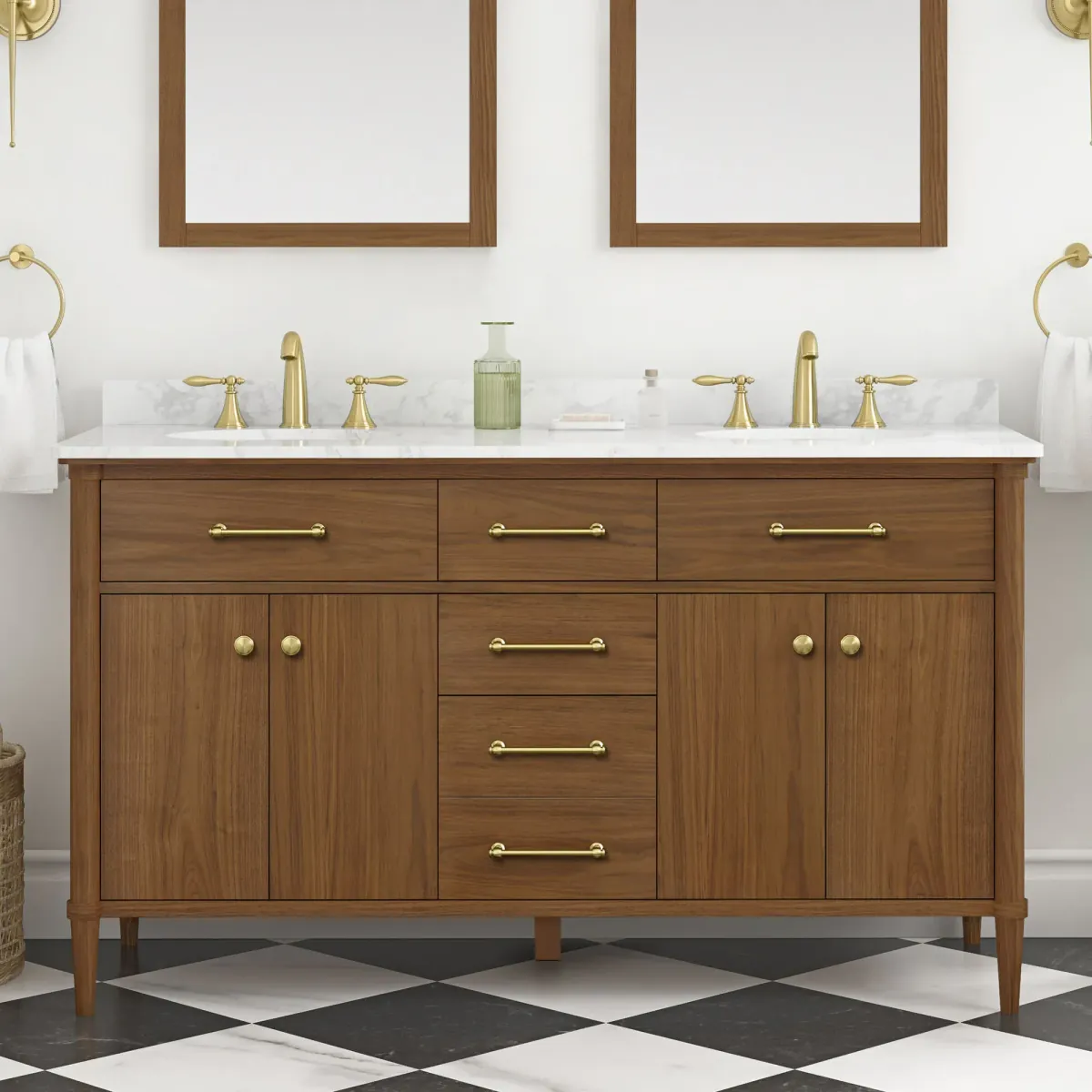 Walnut double sink bathroom vanity with a white marble countertop, brass lever pulls and two wood-framed mirrors